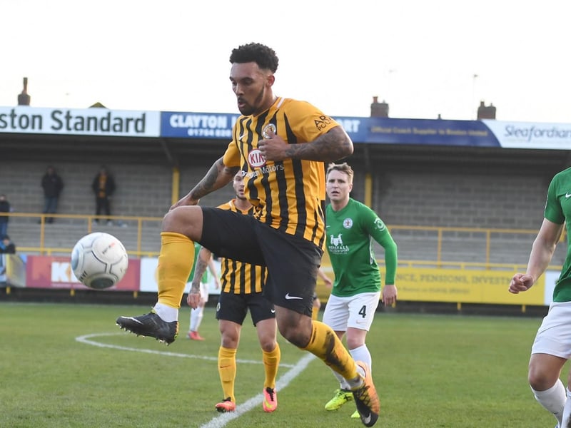 On the ball against Bradford Park Avenue as future teammate Nicky Rowe looks on.