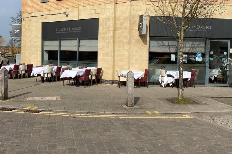 Tables and chairs outside Gurkha Lounge