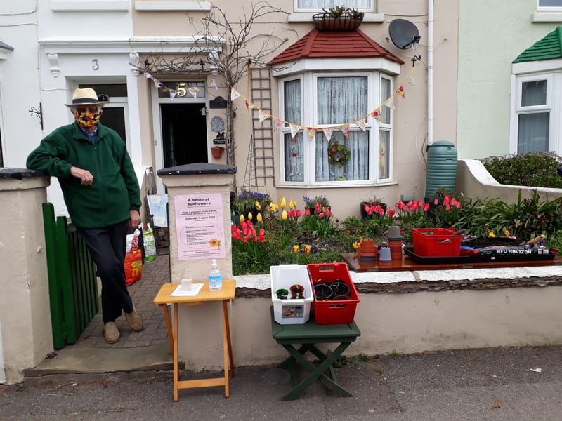 Handing out free seeds to create a Smile of Sunflowers for Southwick