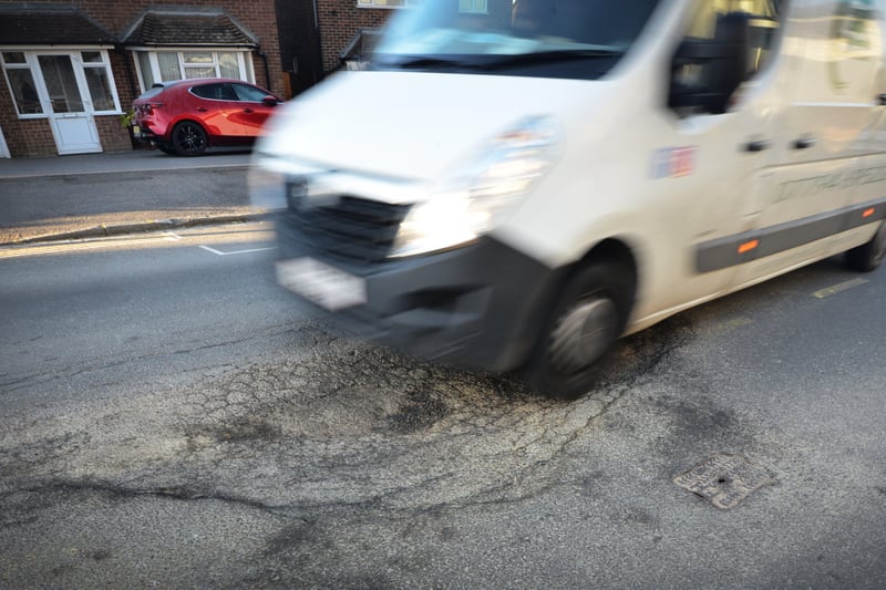 Huge pothole in Buckhurst Road, Bexhill. SUS-210704-091236001