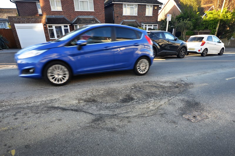 Huge pothole in Buckhurst Road, Bexhill. SUS-210704-091209001