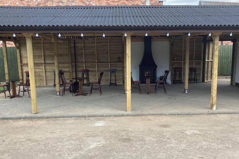 The new covered seating area outside the Brass Windmill in Helpringham. New benches are due to arrive before they open on Friday April 16. EMN-210704-172313001