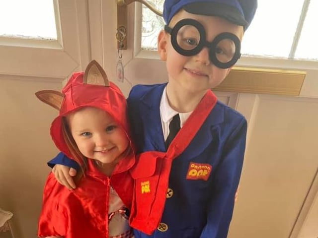 Kettering's Scarlett and Morgan look great as Little Red Riding Hood and Postman Pat!