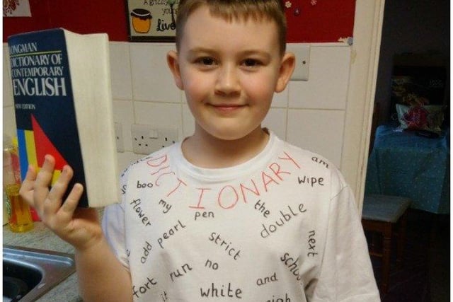 William Besbeech, age 8, who goes to All Saints Primary School, Bexhill. He is celebrating world book day as a dictionary