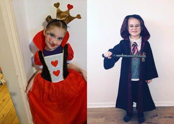 Marilyn-sky, aged seven, from St Andrews Church of England Infants' School dressed as the Queen of Hearts from Alice in Wonderland and Harvey Cook, aged five, from St Andrews Church of England Infants' School as J.K. Rowling's Harry Potter