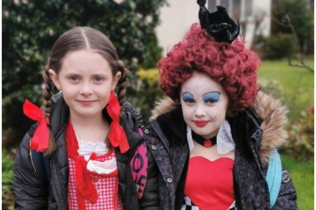 Mylee, 7, as The Queen of Hearts, and Ali, 8, as Little Red Riding Hood. Both attend Little Common School