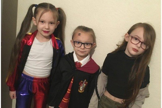 Churchwood Primary Academy students Maddison Hawkins, 9, as Harley Quinn, Kaprice Hawkins, 7, as Harry Potter, and Brooke Hawkins, 10, as Kim Possible
