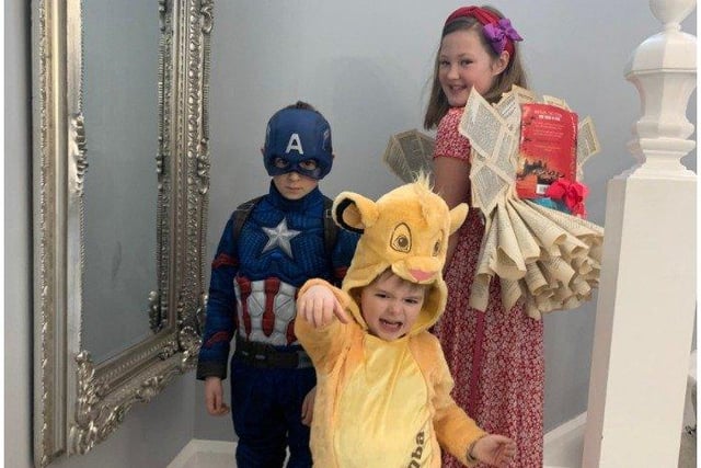 Olivia, aged 10, in her handmade Book Queen Costume, is accompanied by brothers Alexander and Teddy