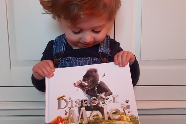 Beki Malik's daughter Aria dressed up as the Disaster Mole from her favourite book, written more than 25 years ago by a family friend, who has since died of motor neurone disease, for his son, who then published it for his own son