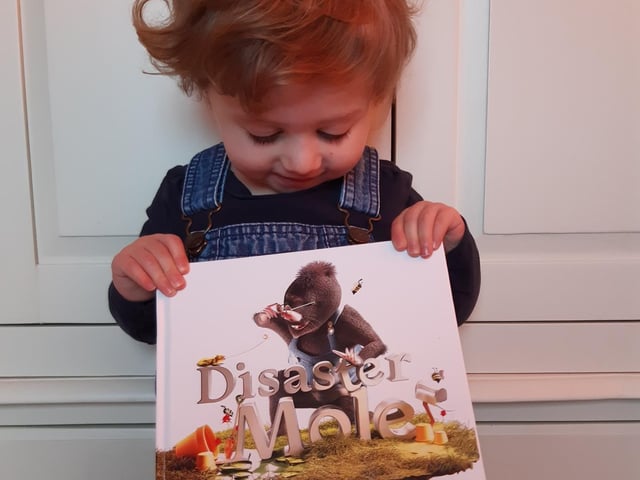 Beki Malik's daughter Aria dressed up as the Disaster Mole from her favourite book, written more than 25 years ago by a family friend, who has since died of motor neurone disease, for his son, who then published it for his own son