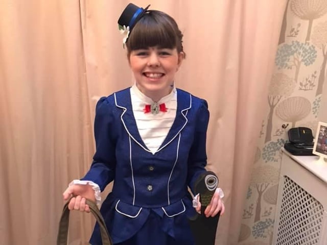 Grace Hollowell, 17, on her way to Billingbrook Special Needs School in Northampton as Mary Poppins for her last World Book Day