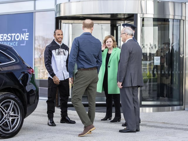 Prince Harry and Lewis Hamilton are welcomed to The Silverstone Experience by chief executive Sally Reynolds