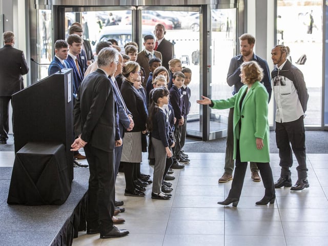 Prince Harry and Lewis Hamilton are greeted after arriving at The Silverstone Experience