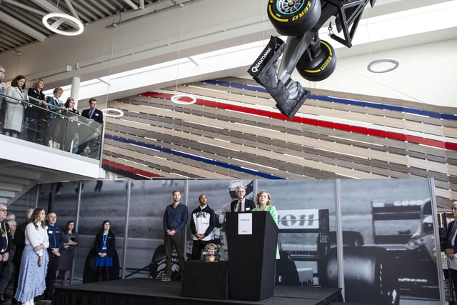 The Silverstone Experience chief executive Sally Reynolds gives a speech with Prince Harry, Lewis Hamilton and a representative from the National Lottery Heritage Lottery Fund