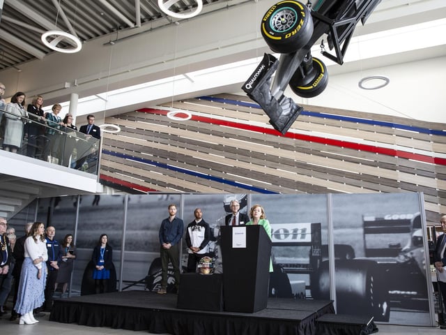 The Silverstone Experience chief executive Sally Reynolds gives a speech with Prince Harry, Lewis Hamilton and a representative from the National Lottery Heritage Lottery Fund