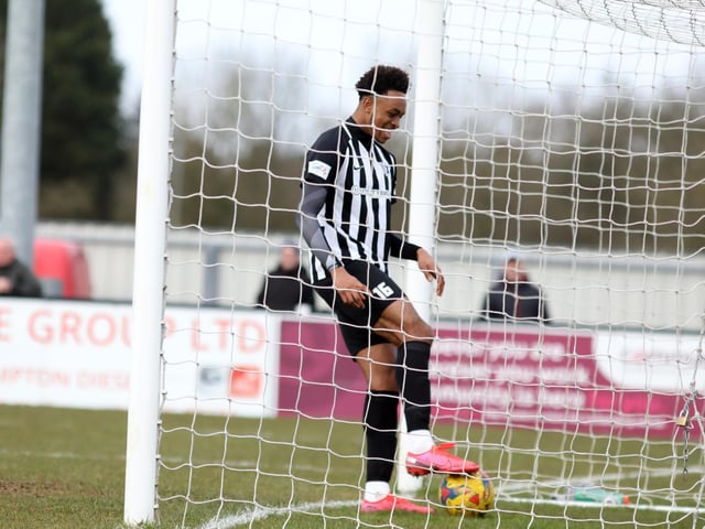 Northampton Town loanee Caleb Chukwuemeka walks the ball into the net for his goal