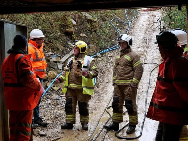 Crews at the entrance to the mine