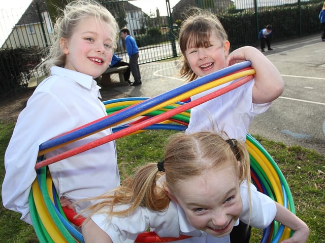 Caught up in the hoopla were Hogsthorpe Primary School pupils, from left, Robyn Block, Ellena Bridger and Hermione Burgess.