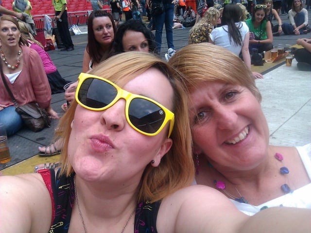 Kara wrote: "Happy Mother's Day to my wonderful Mama Bear. It's really old photo but one of my faves as it was taken at a Take That concert and that's always been our thing xxx"