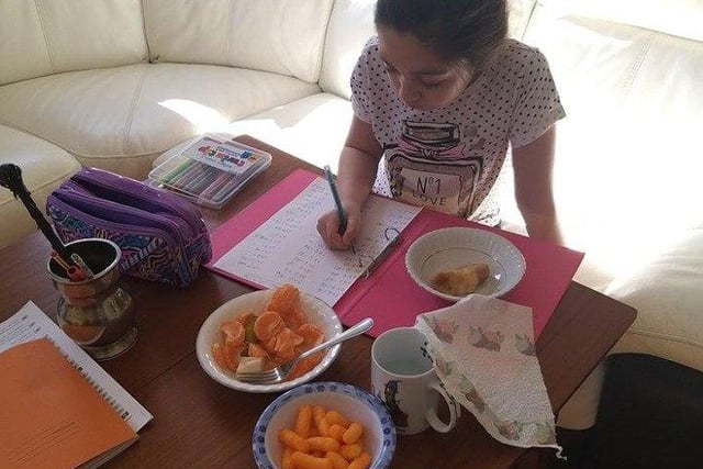 Channie, aged 9, supplements her spelling practice with plenty of healthy snacks-  photo courtsey of Anny Channie Stewart