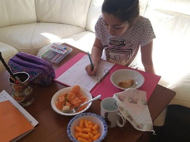 Channie, aged 9, supplements her spelling practice with plenty of healthy snacks- photo courtsey of Anny Channie Stewart