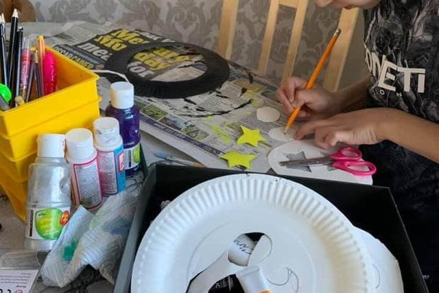 Another picture shared by Ellie Bugden, showing eight year old Jenson making art
