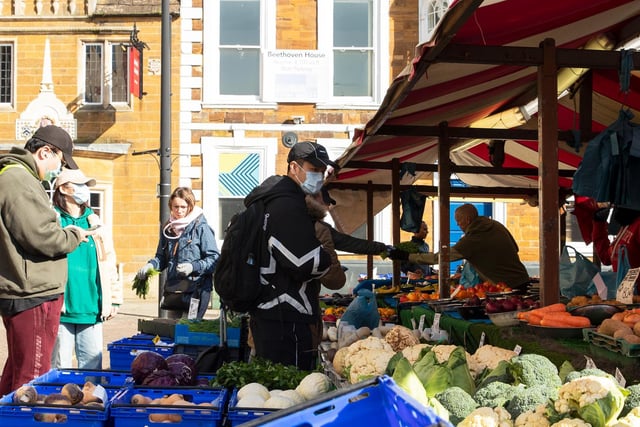 Some people took precautions so they could buy from the market stalls. Photo: Leila Coker