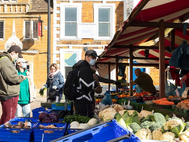 Some people took precautions so they could buy from the market stalls. Photo: Leila Coker