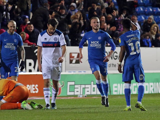 Question 2) Who was the last player to score on his Posh Football League debut? George Cooper is pictured scoring on his Posh debut, but was he the last?