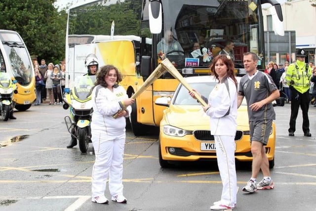 Torchbearers in London Road on their way into the town centre.