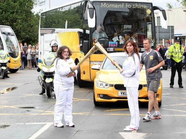 Torchbearers in London Road on their way into the town centre.