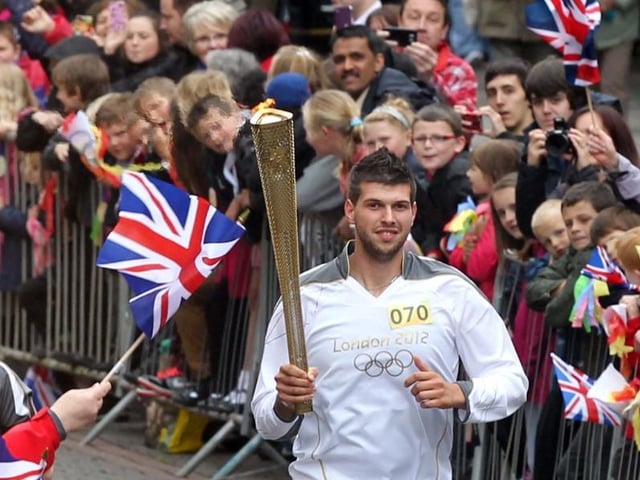 Andrea Candotto Carniel takes the torch through Gold Street