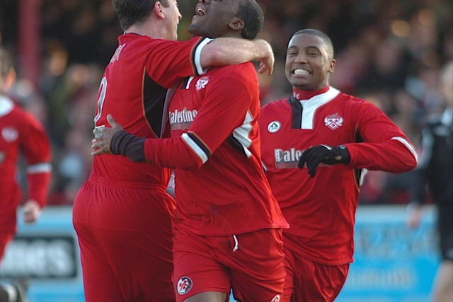 Craig Westcarr is congratulated by Nicky Eaden and Andre Boucaud after his first goal