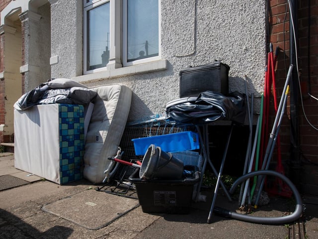 A bed and more left outside a home in Stanhope Road, Queen's Park. Photo: Leila Coker
