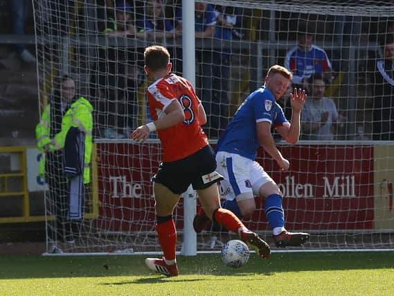 Olly Lee tucks home the equalising goal as Luton won promotion at Carlisle two years ago today