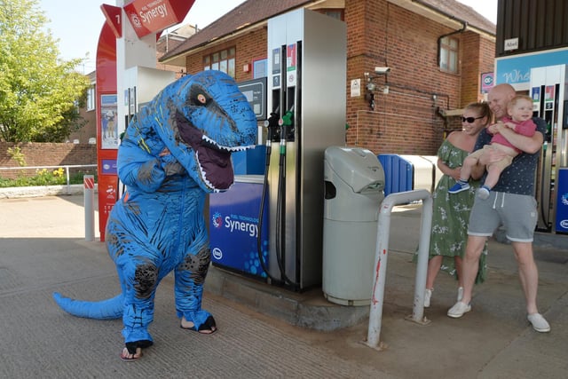 T-Rex Tim causing havoc at the petrol station with Vick, Craig and Rex Fielder 20 months..
