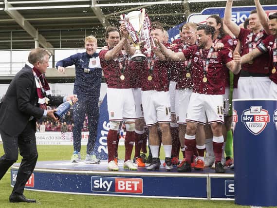 Chris Wilder gets the Champagne spraying started