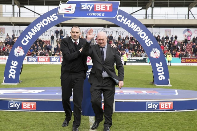 Former Cobblers boss Graham Carr brought the trophy on to the pitch with chairman Kelvin Thomas