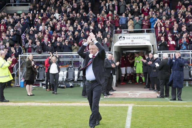 Chris Wilder applauds the Cobblers support - who cheer him on to the Sixfields pitch
