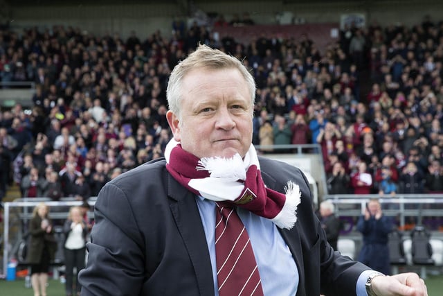 Chris Wilder heads for the centre of the pitch and the podium