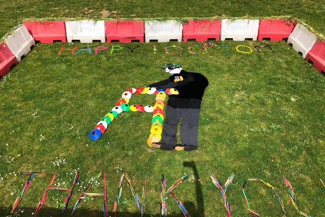 Children from Kempston Rural Primary School have used different school equipment to create an 'Art Attack' style big art on the school field to celebrate Captain Tom Moore's birthday