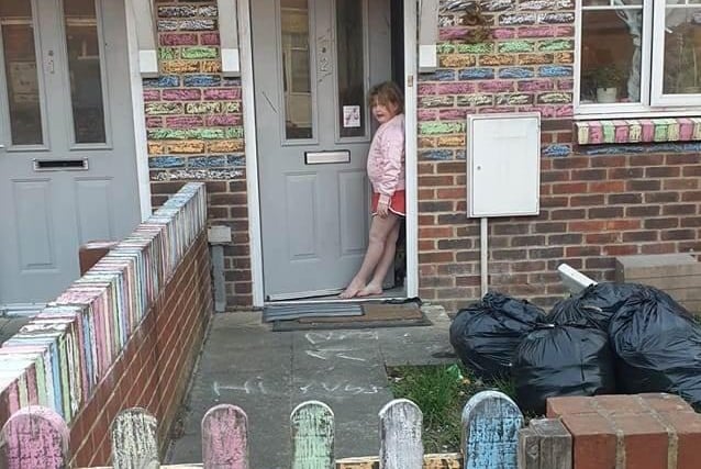 Elley Grace Newman snapped the chalk decorations by her children at the front of her house for the NHS