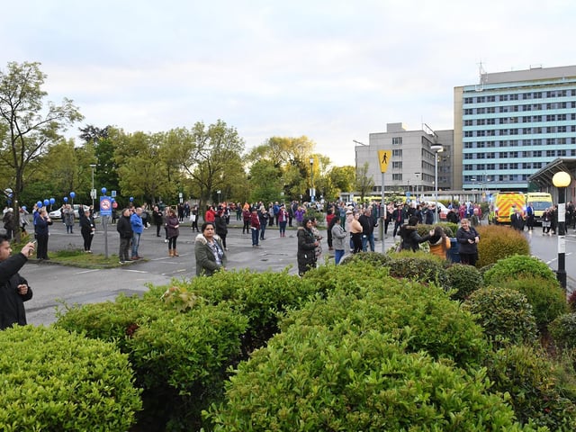Staff gathered in the car park, ready to honour Kumar's memory.