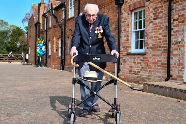 British World War II veteran Colonel Tom Moore poses with his walking frame doing a lap of his garden in the village of Marston Moretaine.