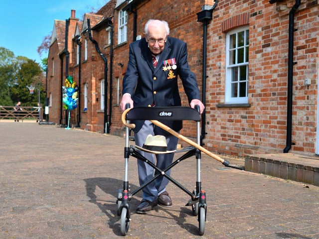 British World War II veteran Colonel Tom Moore poses with his walking frame doing a lap of his garden in the village of Marston Moretaine.