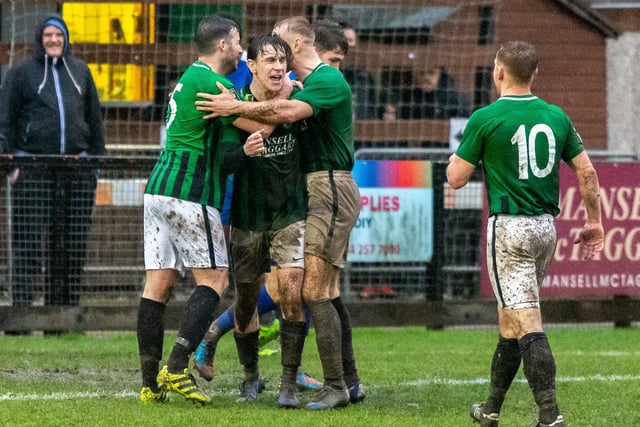Goalscorer Louie Downey is surrounded by his team mates v Three Bridges 15th February