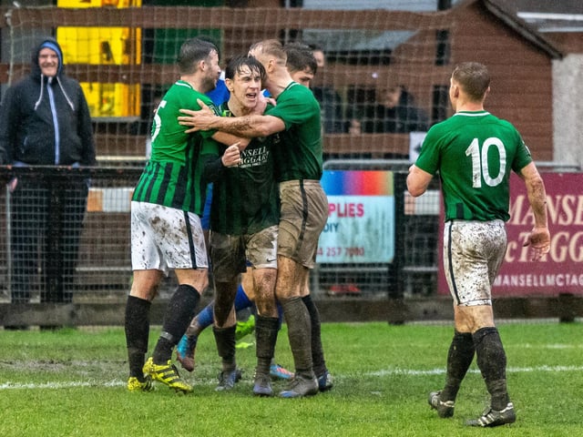 Goalscorer Louie Downey is surrounded by his team mates v Three Bridges 15th February