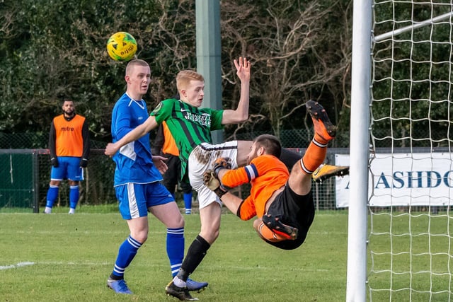 Mason Doughty's goal attempt is thwarted by the Faversham Town goalie 14th December