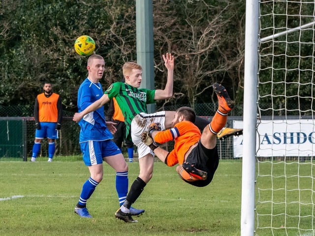 Mason Doughty's goal attempt is thwarted by the Faversham Town goalie 14th December