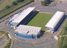 22nd OXFORD UNITED. A three-sided stadium starts with an obvious disadvantage when judging an atmosphere. A car park behind one goal instead of away fans for so long is rather sad, even for a talented home team.